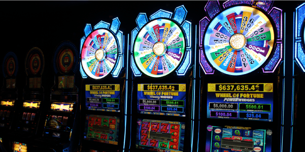 Close-up of a progressive e-game machine featuring a "Wheel of Fortune" theme.