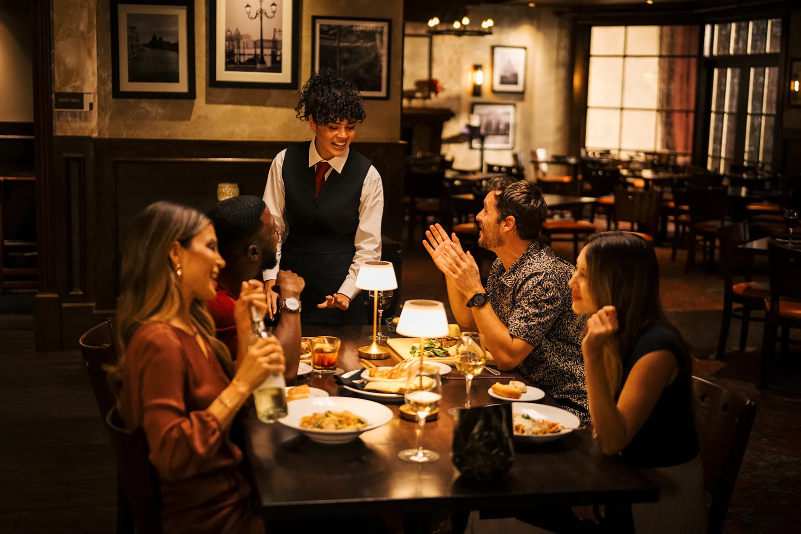 A table being served at Vinos Italian Steakhouse at WinStar World Casino and Resort.