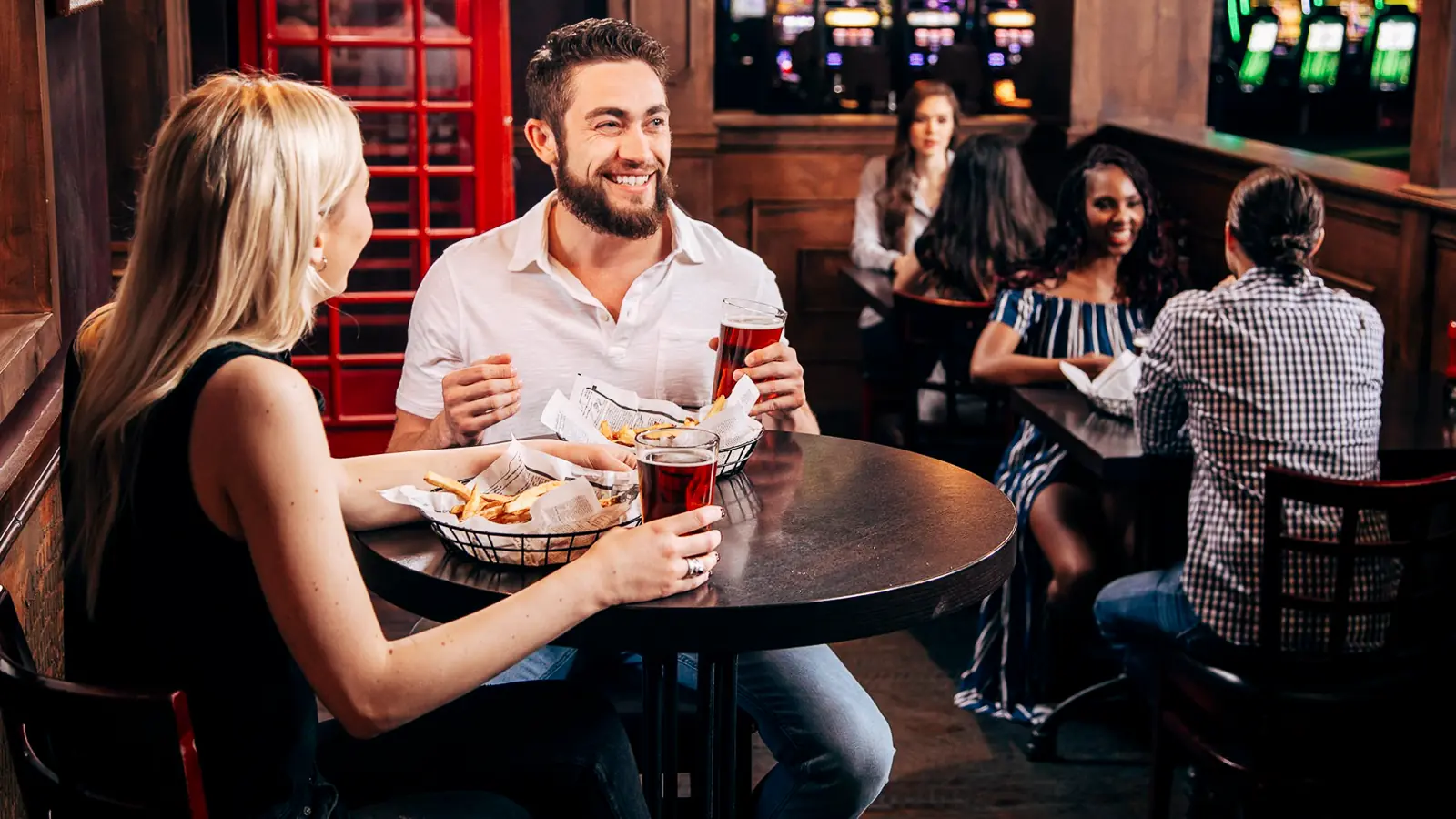 A couple enjoying a meal at Chips 'N' Ales at WinStar World Casino and Resort.