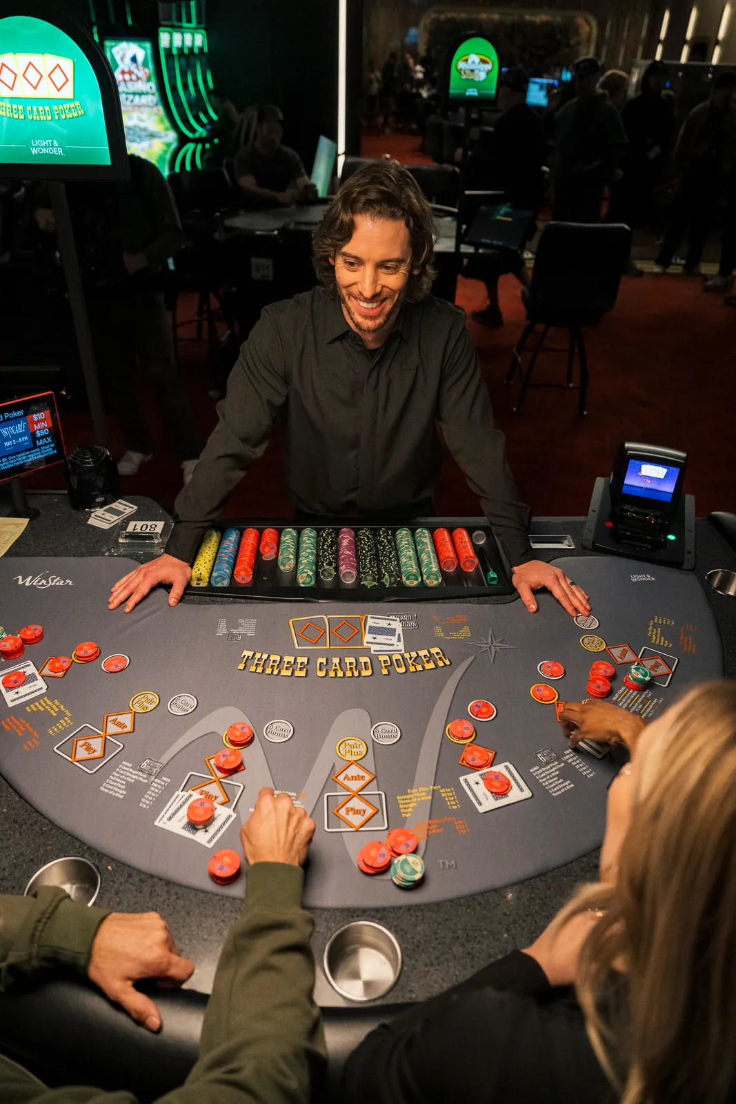 A dealer at a Three Card Poker table at WinStar World Casino and Resort.
