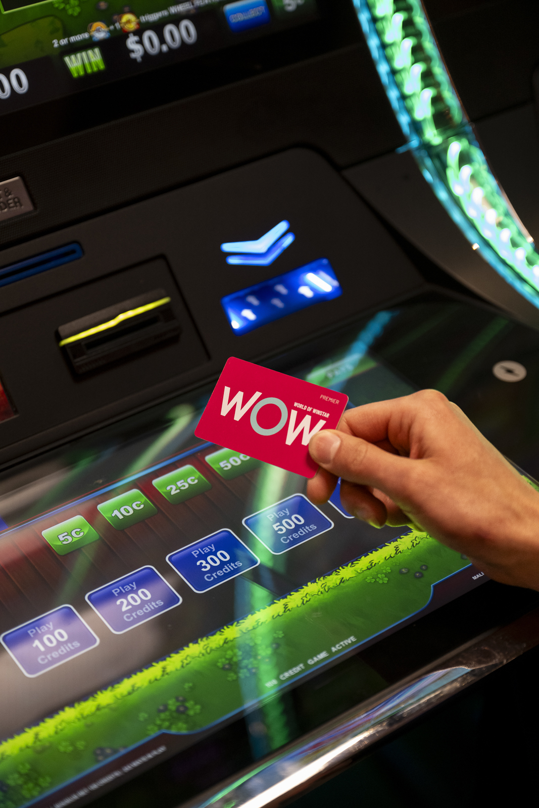 a WinStar World Casino & Resort Club Passport in front of an electronic game. 