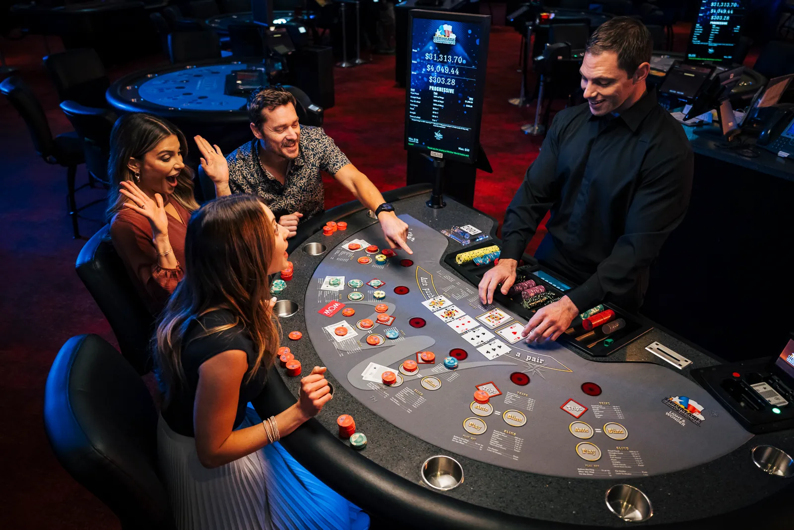 An excited group playing Ultimate Texas Hold 'Em at WinStar World Casino and Resort.