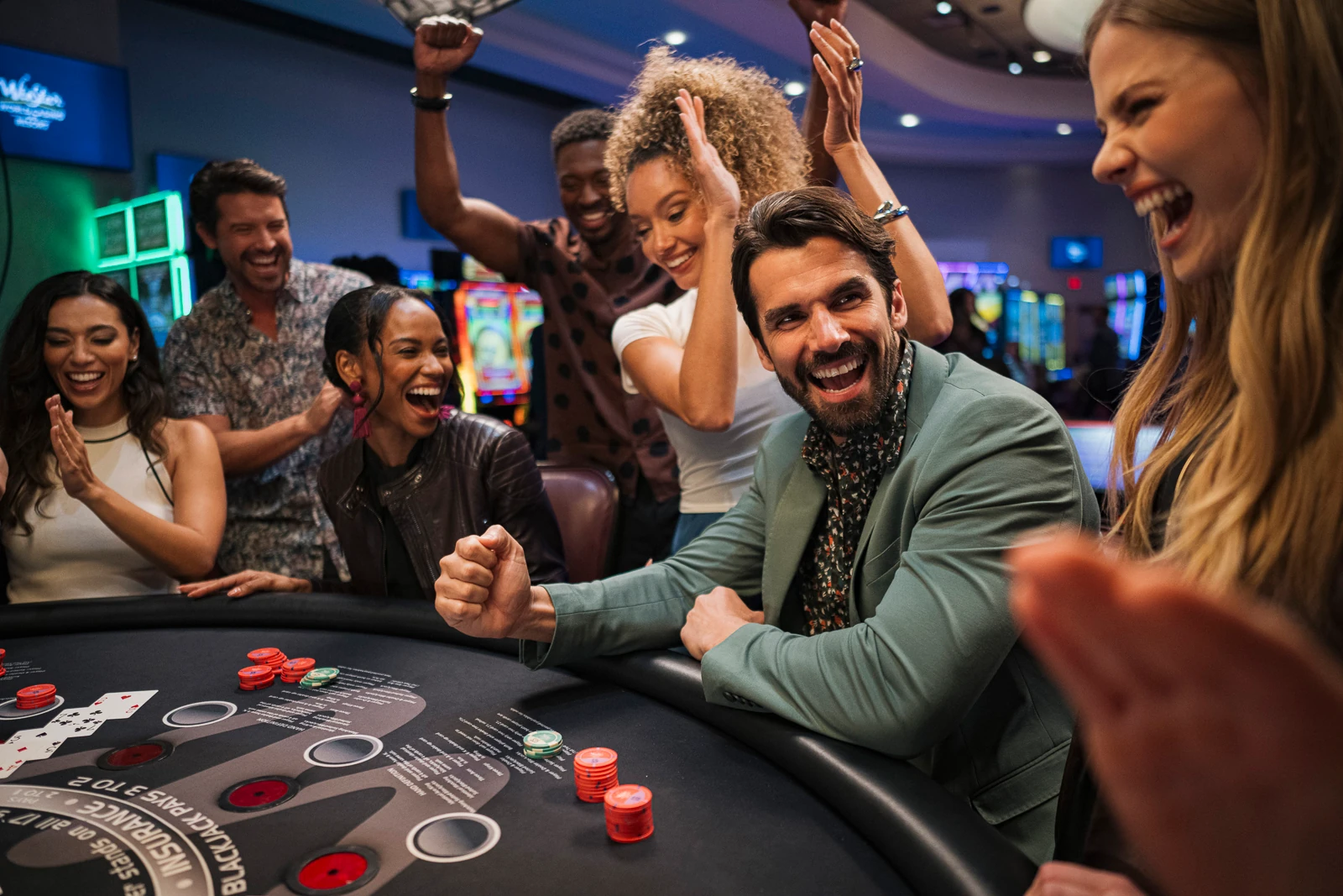 A group of people playing Blackjack at WinStar World Casino and Resort.