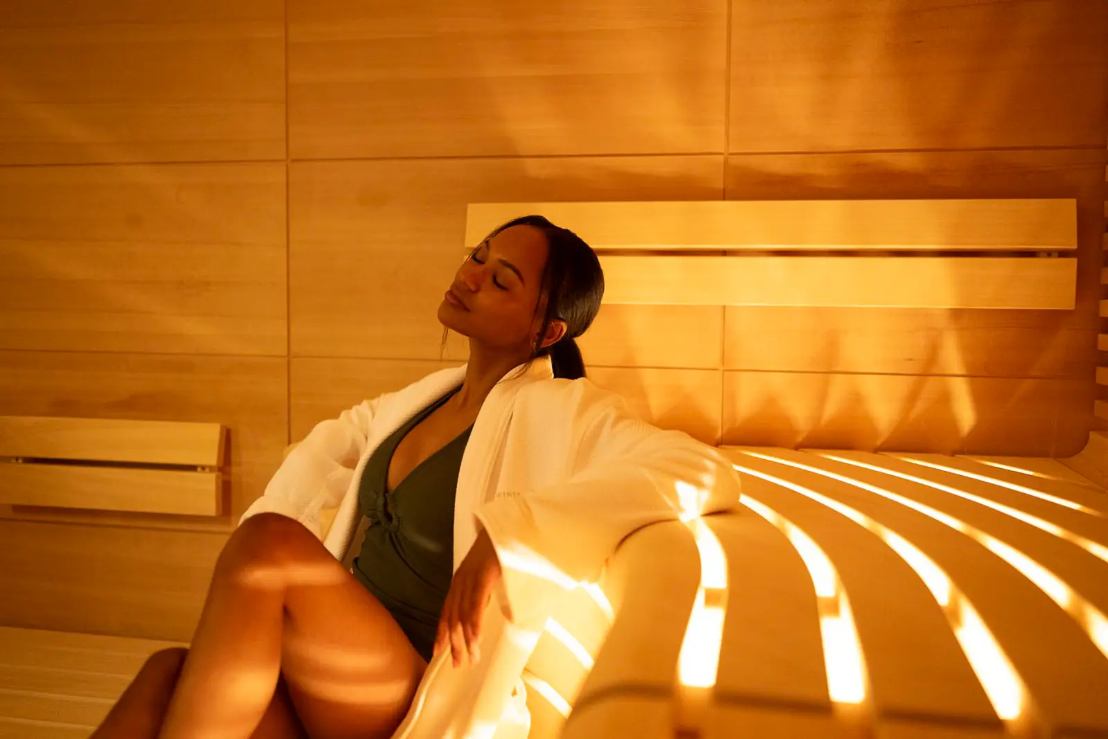 A woman relaxing in the sauna at WinStar Spa.
