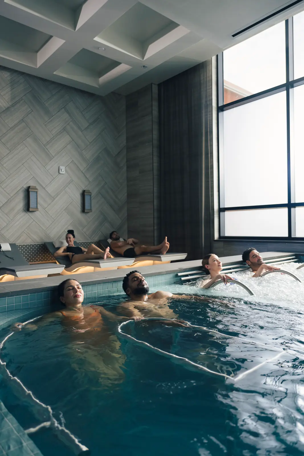 Many people enjoying a relaxing pool at WinStar Spa.