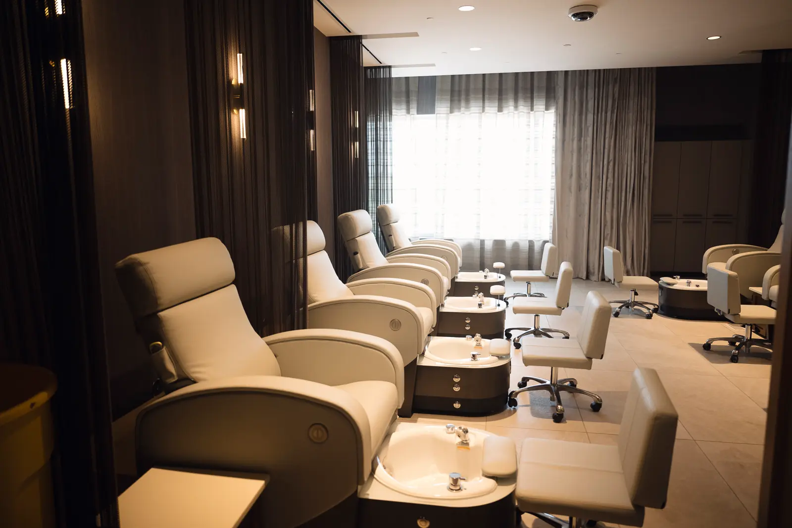 Pedicure chairs lined up at the WinStar Spa.