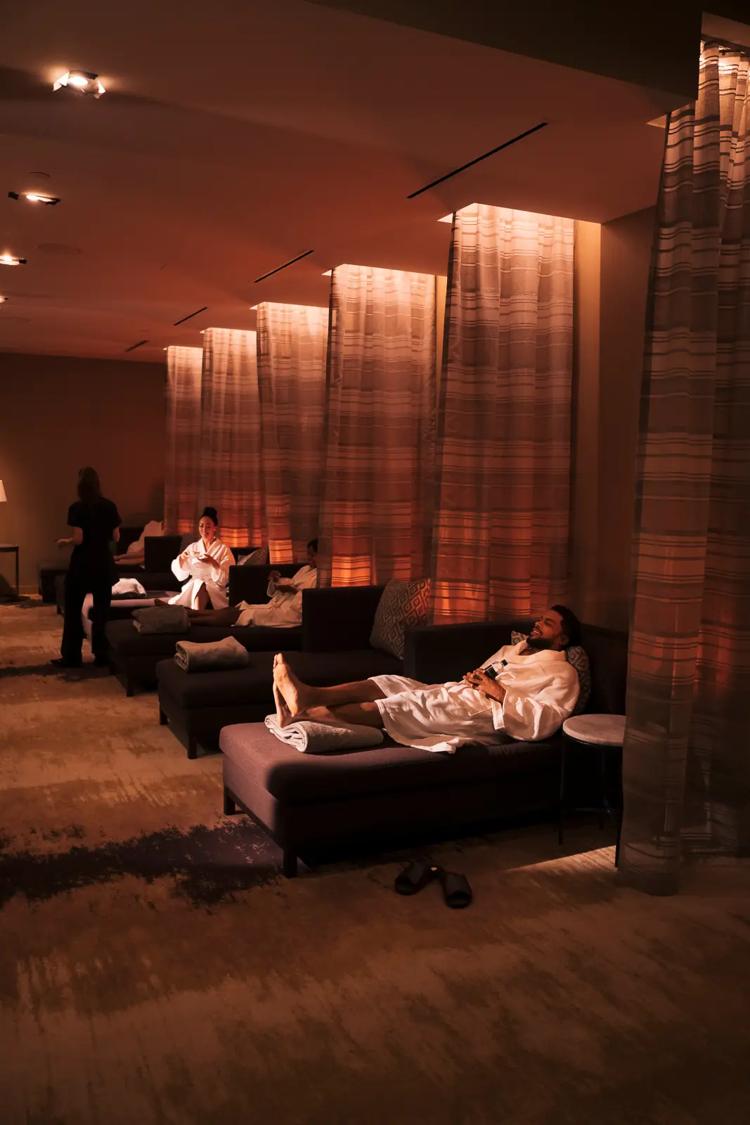 A man relaxing in a lounge chair in the WinStar spa.
