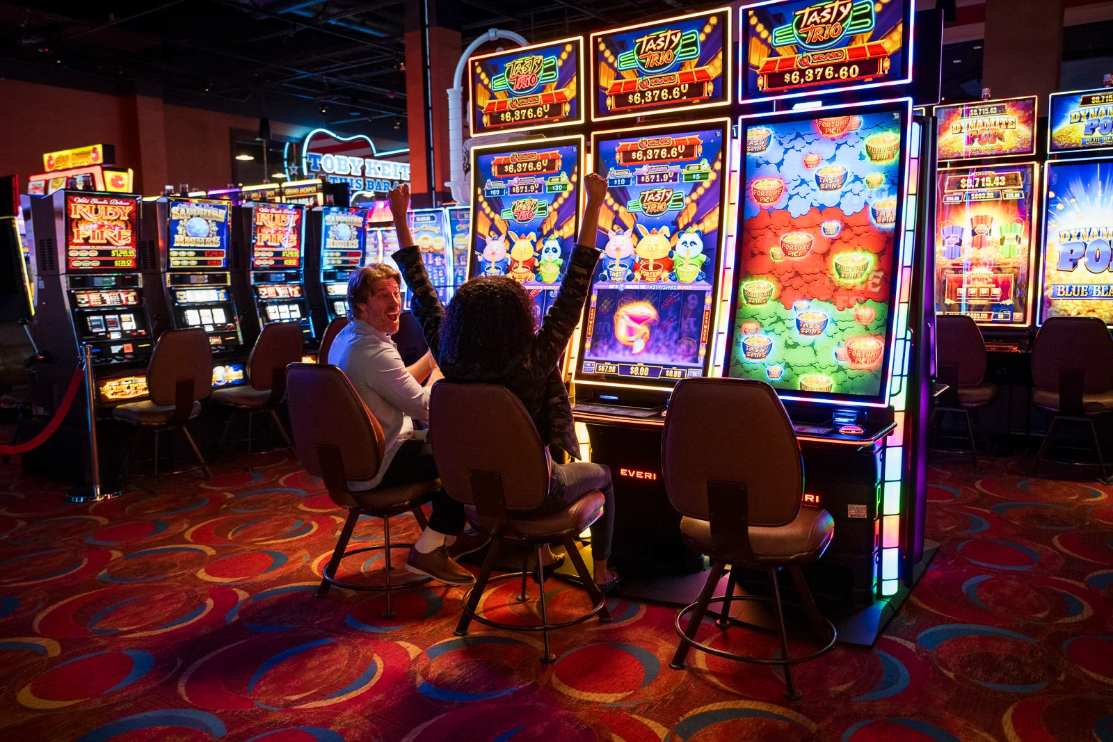 Someone very excitedly playing electronic games at WinStar World Casino and Resort.