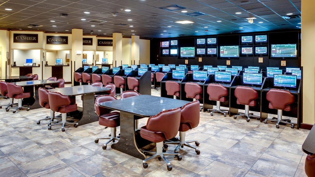 The off track betting facility at WinStar World Casino and Resort. There are rows of chairs and tvs to enjoy.