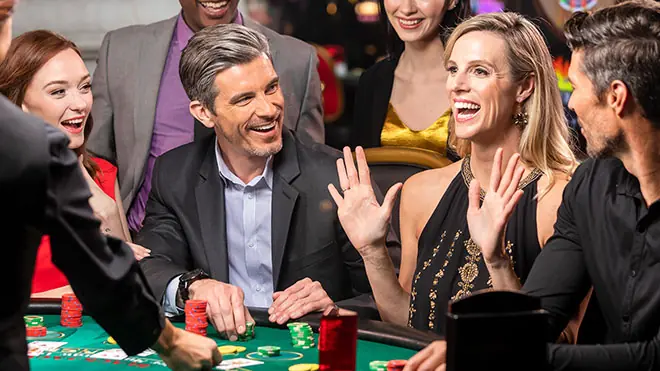 A couple enjoying their time at a table game at WinStar World Casino & Resort.