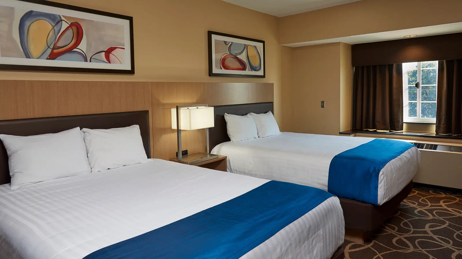 Two beds at The Inn at WinStar.