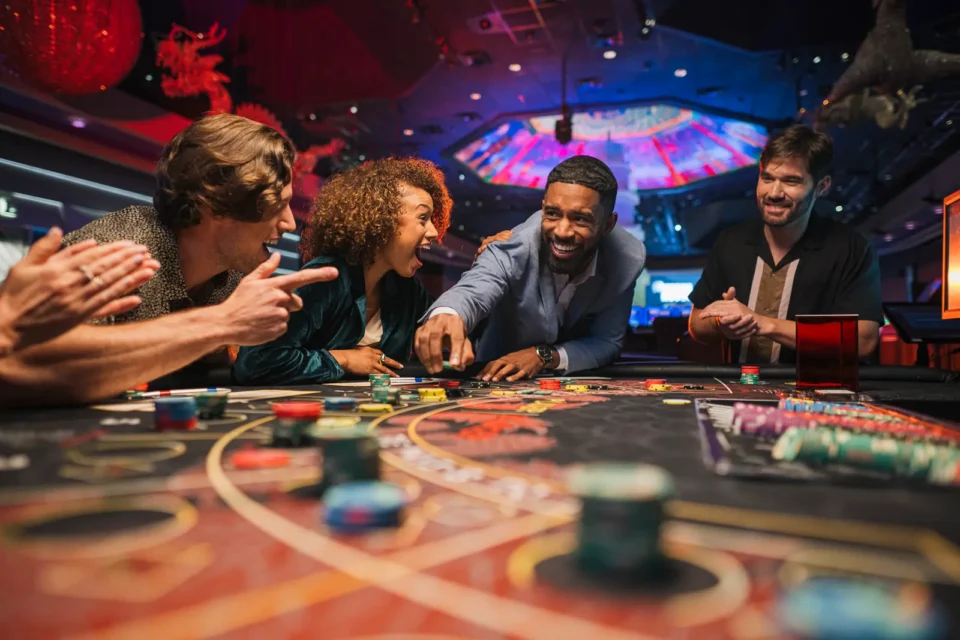A group playing table games at WinStar World Casino and Resort.
