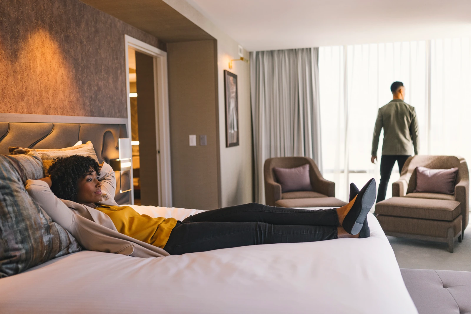 A couple enjoying a room at WinStar World Casino Hotel.
